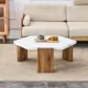Modern practical MDF coffee table with white tabletop and wooden toned legs. Suitable for living rooms and guest rooms. Modern practical MDF coffee table with white tabletop and wooden toned legs. Suitable for living rooms and guest rooms.